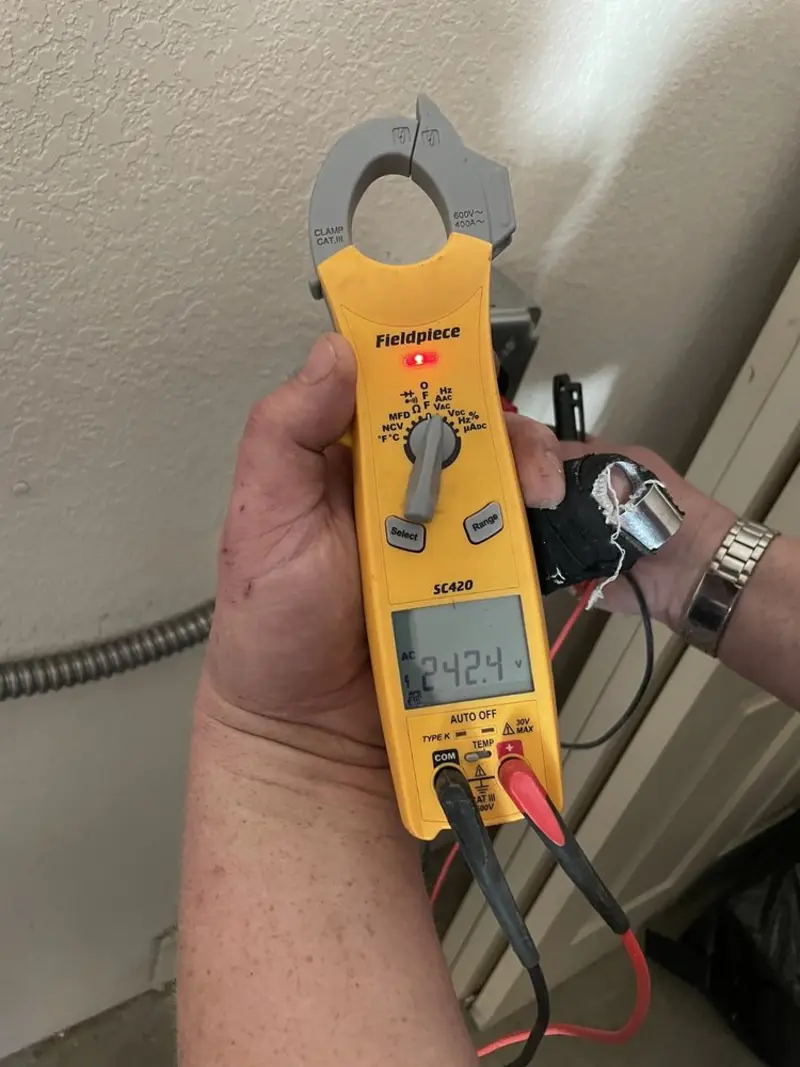 Voltage testing with clamp meter during Whole House Surge Protector in Bethel